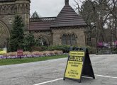 Sign saying Forest Hills Cemetery is now closed