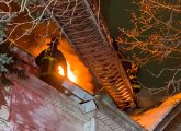 Firefighter on roof at Glenway Street