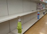 Empty paper-towel and toilet-paper shelves at Dedham Stop and Shop