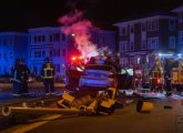 Crash scene in Mattapan - traffic light destroyed, car bursts into flames