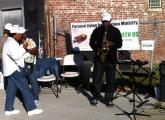 Playing the sax on Blue Hill Avenue