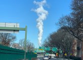 Plume of smoke or water vapor rises above Storrow Drive