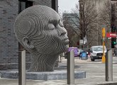 Giant-head statue outside Boston Arts Academy