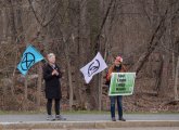 Protesters in front of the woods