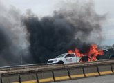 Flaming pickup and SUV