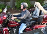 Man and blonde dummy on a motorcycle in Coolidge Corner