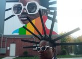 Woman dressed like the McBride Street mural in Jamaica Plain