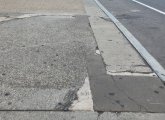 Filled in sidewalk crack that looks like New Hampshire