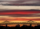 Sunset over the Tobin Bridge and birds