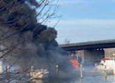 Boat on fire on the Mystic River