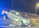 Pickup truck sitting on Jersey barriers at Lynnfield tunnel