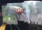 Third rail on fire in the rain