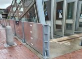 Metal barrier being installed around Aquarium entrance.