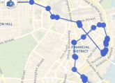 A map of Boston. A blue line meanders and loops across the map, approximating a random walk.  It goes on tiny streets, loops around, and seems to seek out busy intersections intentionally.