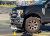 Remains of the bike under the wheels of a pickup