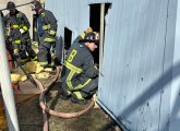 Firefighter checks under MRI structure at VA Hospital