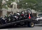 Mopeds about to be hauled off