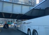 Bus stuck under a bridge on Storrow Drive