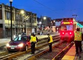 Car on the E Line tracks at Brigham Circle