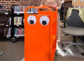 Googly-eyed book cart at Jamaica Plain library