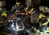 Firefighters on roof checking to make sure the fire hasn't spread