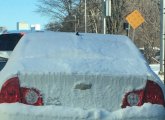 Snow covered car on Tremont Street