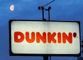 Moon over a Dunkin' sign