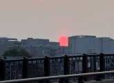 Hazy red sunrise over Boston