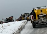 Line of salt trucks waiting to pick up salt at Public Works shed in West Roxbury