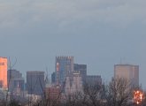 Two downtown building fiercely reflecting the setting sun around 4:05 p.m.