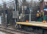 Workers wait for signal to work on signals at Wood Island