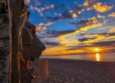 Revere Beach concrete lion watches the sunrise