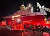 Firefighters going aboard the Symphony