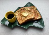 French toast with syrup on a Christmas-tree plate