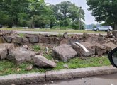 Knocked over stone wall across from Jamaica Pond