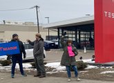 Anti-Musk protesters outside Tesla showroom in Dedham