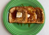 Three slices of French Toast on a green plate