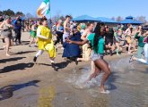 People running into the water at Constitution Beach