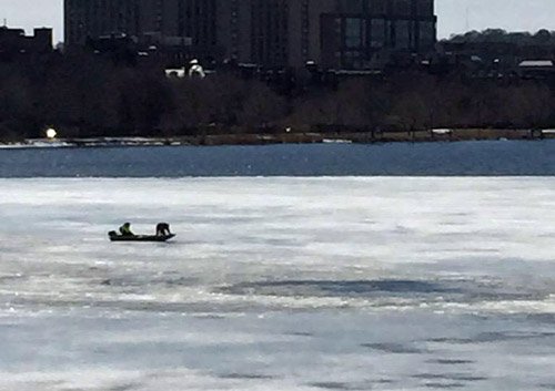 Boat on ice in the Charles River