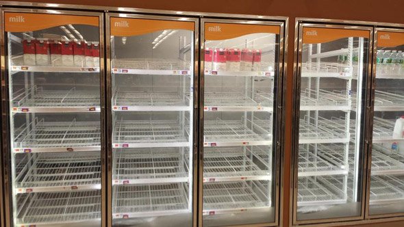 Empty milk shelves at Shaw's in Allston