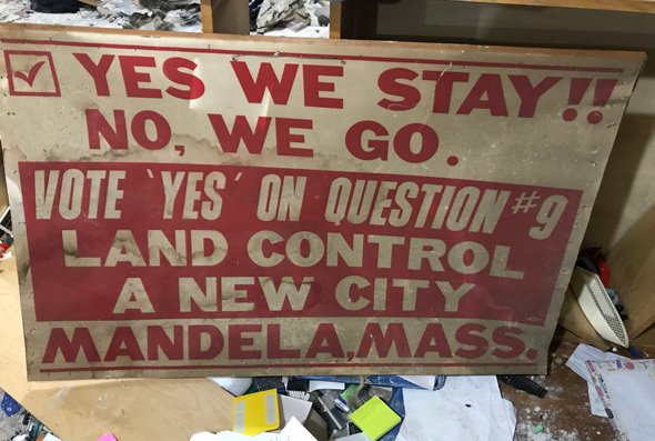 Old sign uring a vote to create the city of Mandela.