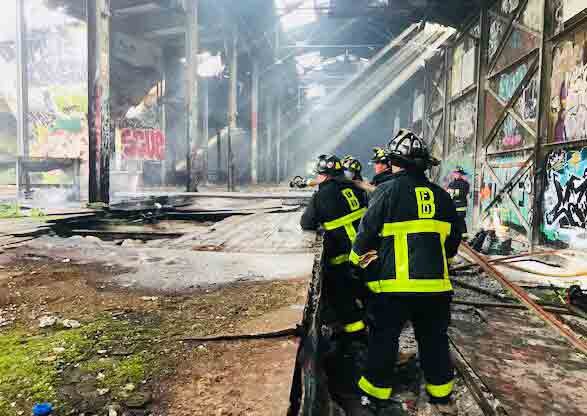 Boston firefighters in old mill building