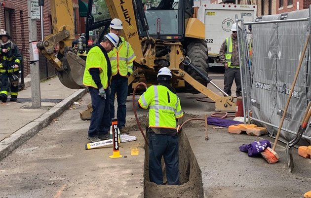 Workers fixing gas leak outside 1065 Tremont St.