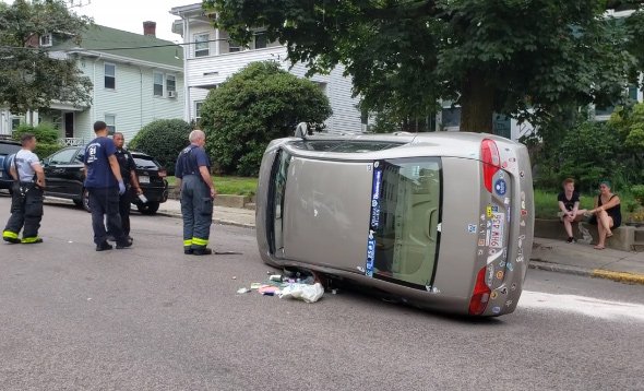 Flipped car in Jamaica Plain