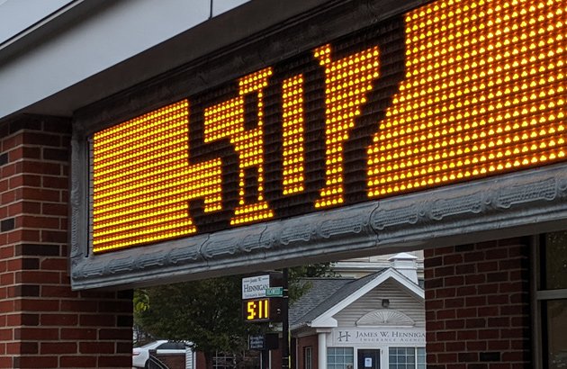 Two clocks, two different times in West Roxbury