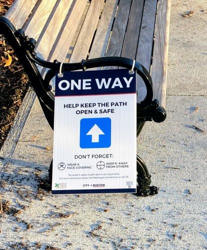 "one way" pedestrian sign on bench at Jamaica Pond