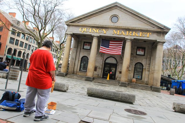 Lonely performer in front of the Quincy Market building