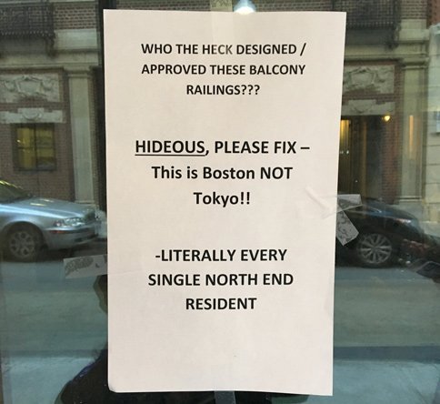 Get rid of these stupid railings - Boston is not Tokyo - sign says