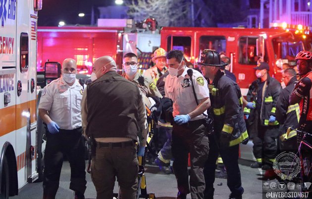 Patient being loaded into ambulance on Columbia Road