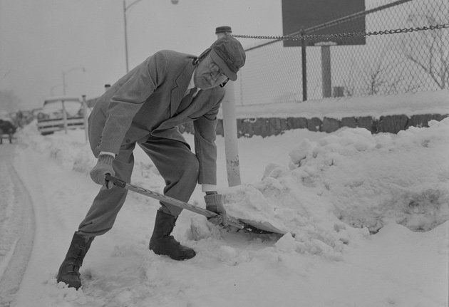 Paul Dudley White shoveling snow